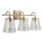 Capital Lighting 139132AD-496 Aged Brass 24'' W X 10.5'' H X 9'' E 3-light Vanity In Aged Brass With Clear Seeded Cone Glass Shades Image 1