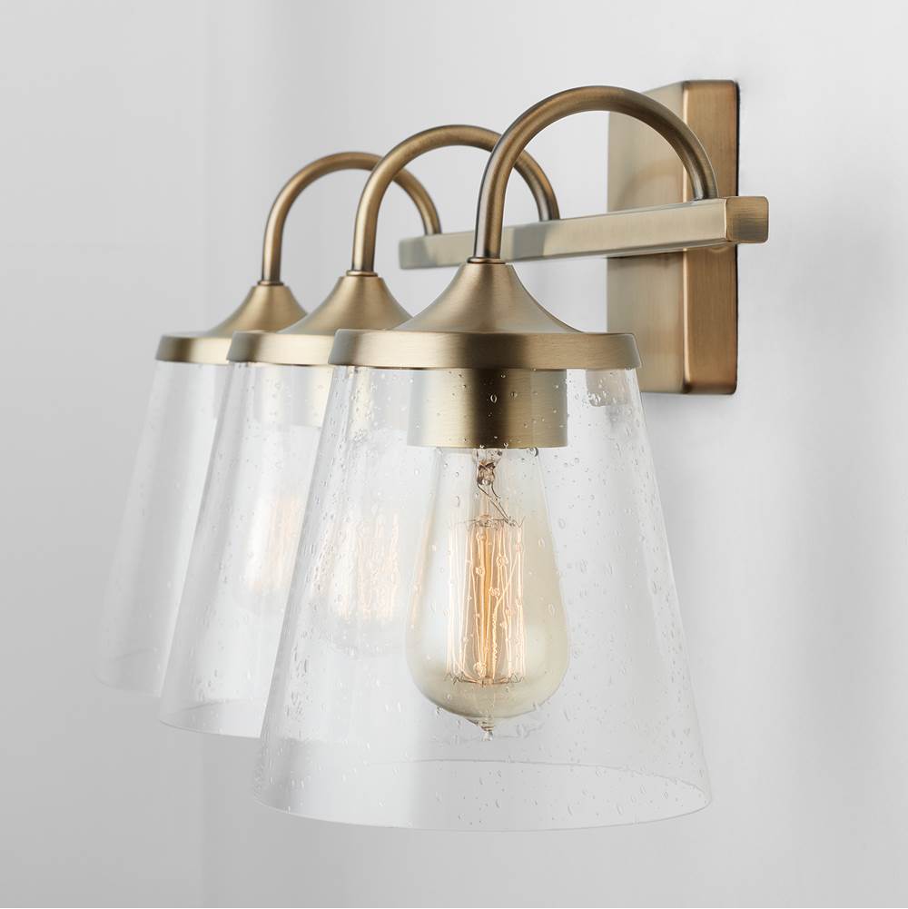 Capital Lighting Jayne 24'' W X 10.5'' H X 9'' E 3-light Vanity In Aged Brass With Clear Seeded Cone Glass Shades