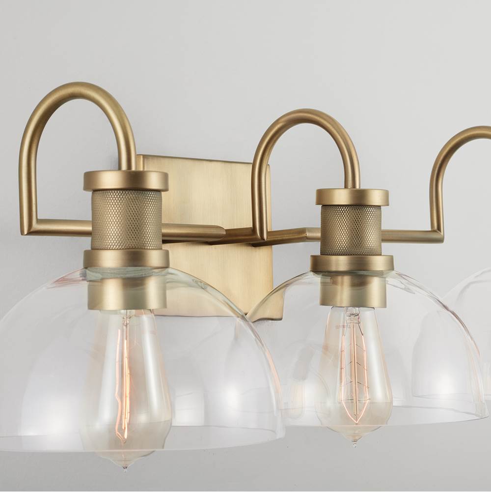 Capital Lighting Cassidy 27'' W X 9'' H X 10.5'' E 3-light Vanity In Aged Brass With Clear Glass Dome Shades