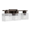 Capital Lighting 139134OR-498 Oil Rubbed Bronze 24'' W X 8'' H X 6'' E 3-light Vanity In Oil Rubbed Bronze With Clear Seeded Glass Shades - Barn Door Farmhouse Style Image 1