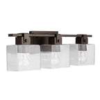 Capital Lighting 139134OR-498 Oil Rubbed Bronze 24'' W X 8'' H X 6'' E 3-light Vanity In Oil Rubbed Bronze With Clear Seeded Glass Shades - Barn Door Farmhouse Style Image 1