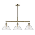 Golden Lighting 3306-LP AB-CLR Aged Brass Yep By Golden Lighting Orwell 3-light Island Light In Aged Brass And Clear Glass Image 1